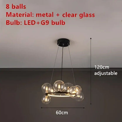 A modern black metal chandelier with eight clear glass led spheres featuring led plus g9 bulbs for dining room decorbites clear glass lighting