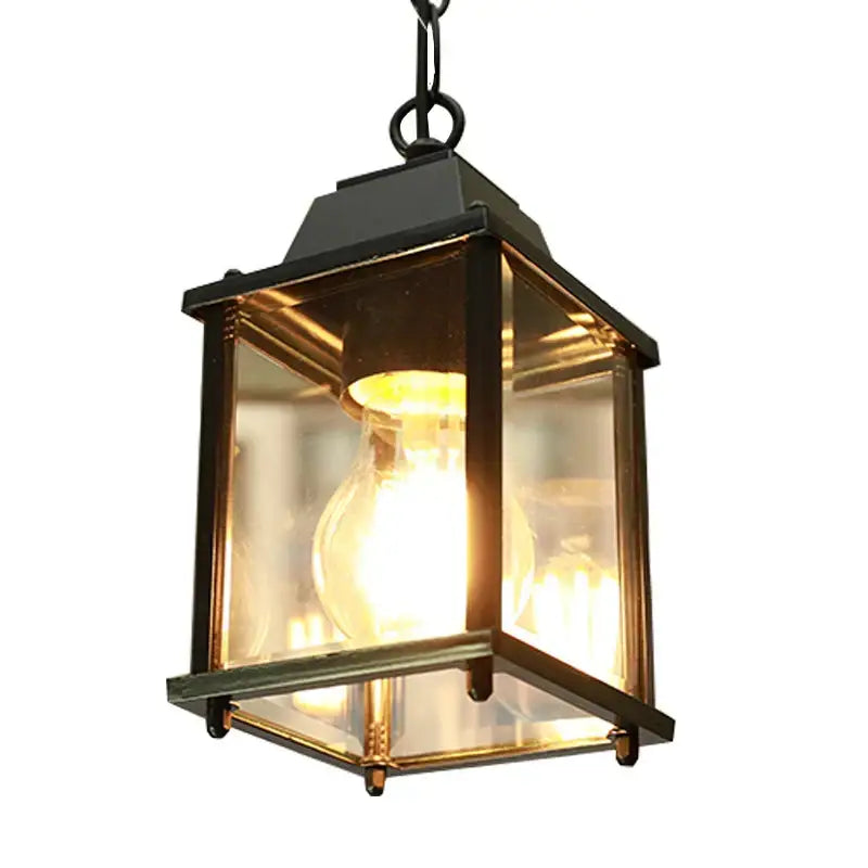 Modern black metal pendant lamp with clear glass panels and warm glowing bulb for decorbites garden pendant light