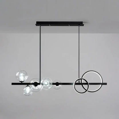 Modern black metal pendant light fixture with clear glass spheres and glowing rings for dining room ceiling light