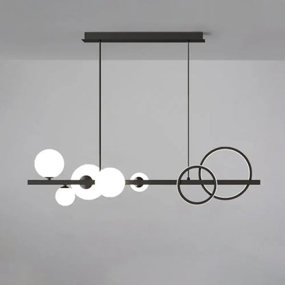 Modern black metal pendant light fixture with spherical glass shades for dining room ceiling light use