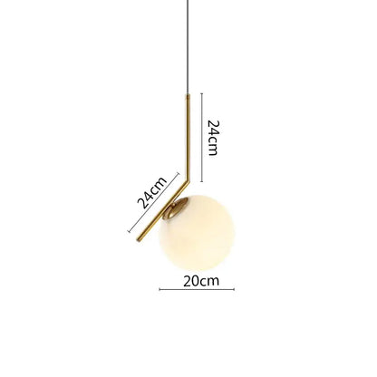 Modern black metal ring pendant light with brass finish, frosted glass globe, and angular metal arm for dining room