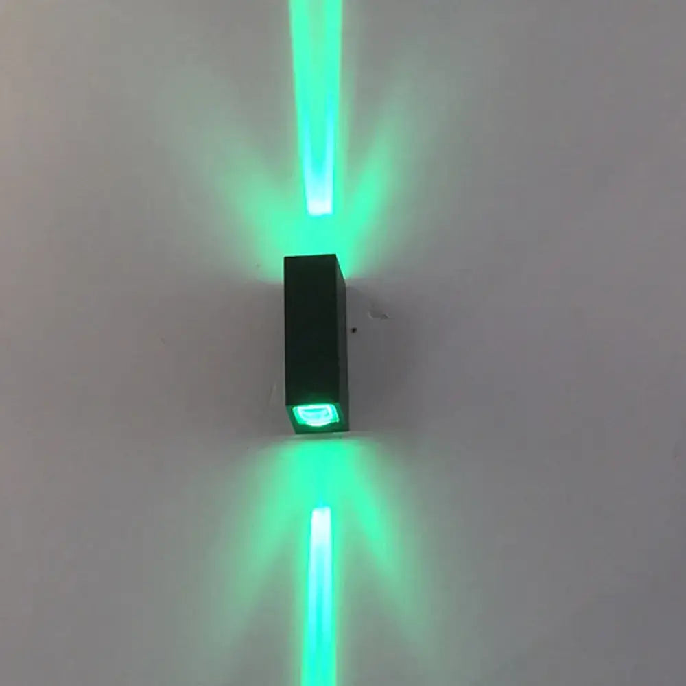 Modern black metal shade wall lamp emitting vibrant green laser beams upward and downward 110v-120v 220v-240v
