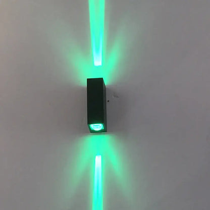 Modern black metal shade wall lamp emitting vibrant green laser beams upward and downward 110v-120v 220v-240v