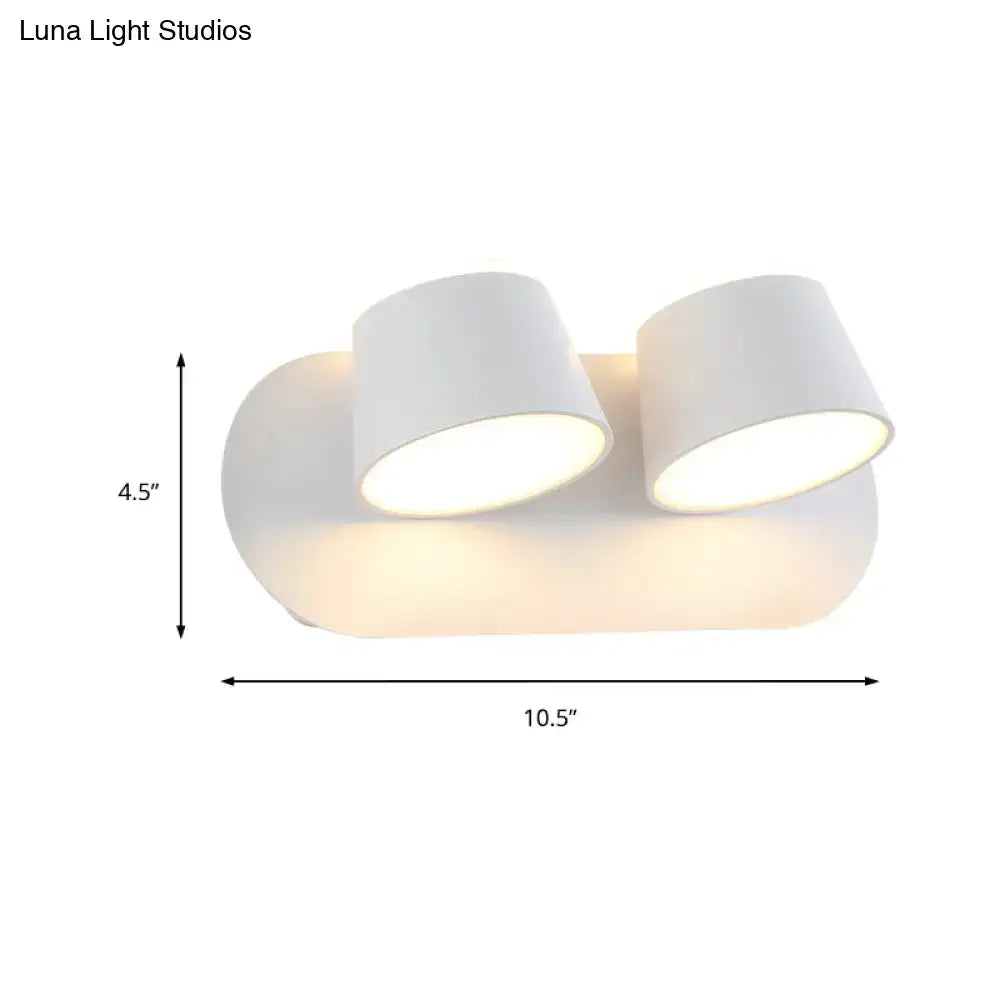 White dual-head wall sconce with metal shade, sleek fixture width, and shade height for modern bedroom vanity lighting
