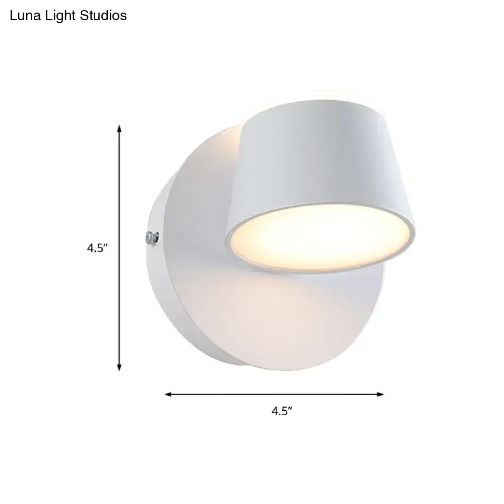 Modern black metal shade wall sconce with white cylindrical fixture and adjustable head for bedroom vanity use