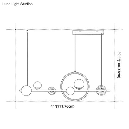 Modern black metal pendant light with spherical glass elements and circular accents for dining room lighting