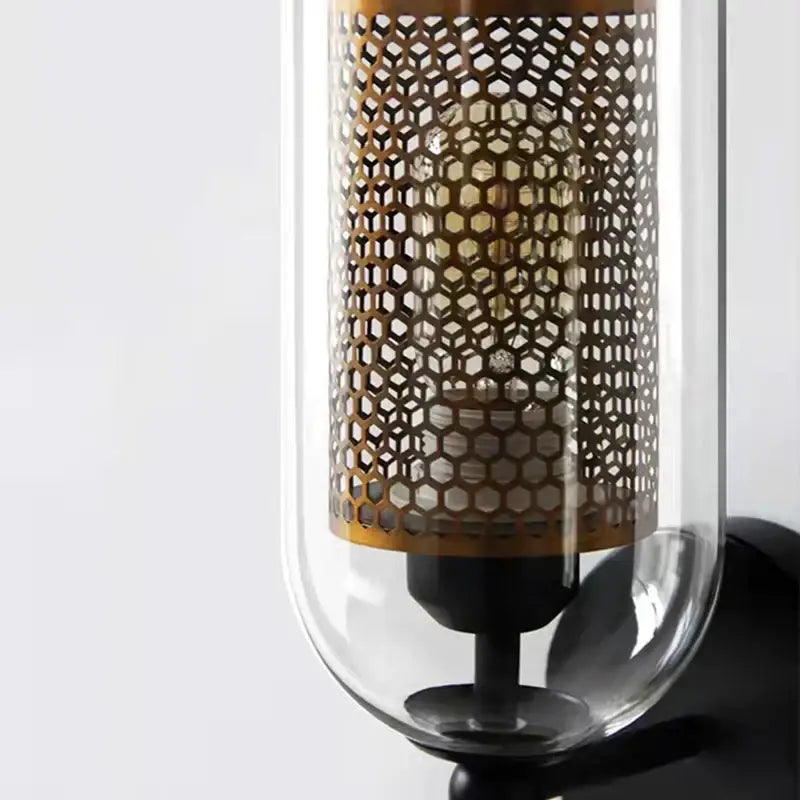 Modern black metal wall light with clear glass and intricate brass honeycomb shade for bedroom decorbites clear glass lighting