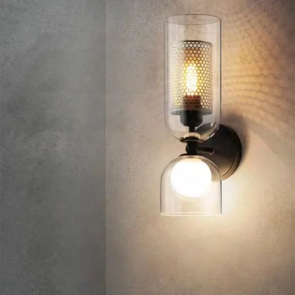 Modern black metal wall light with clear glass cylinder and perforated shade for bedroom sconce decorbites clear glass