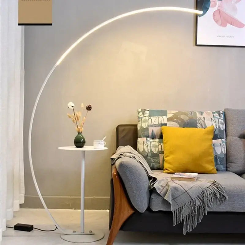A sleek black minimalist arc floor lamp with a curved white frame and dimmable integrated led lighting for living room