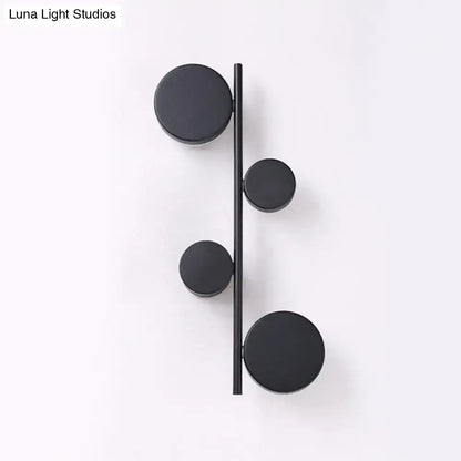 Modern black minimalist circle wall mount led sconce with four circular discs for living room lighting