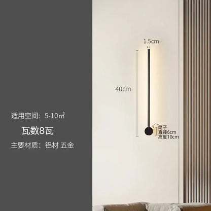 A sleek modern black wall lamp with a slim cylindrical body by decorbites led strip for staircase lighting