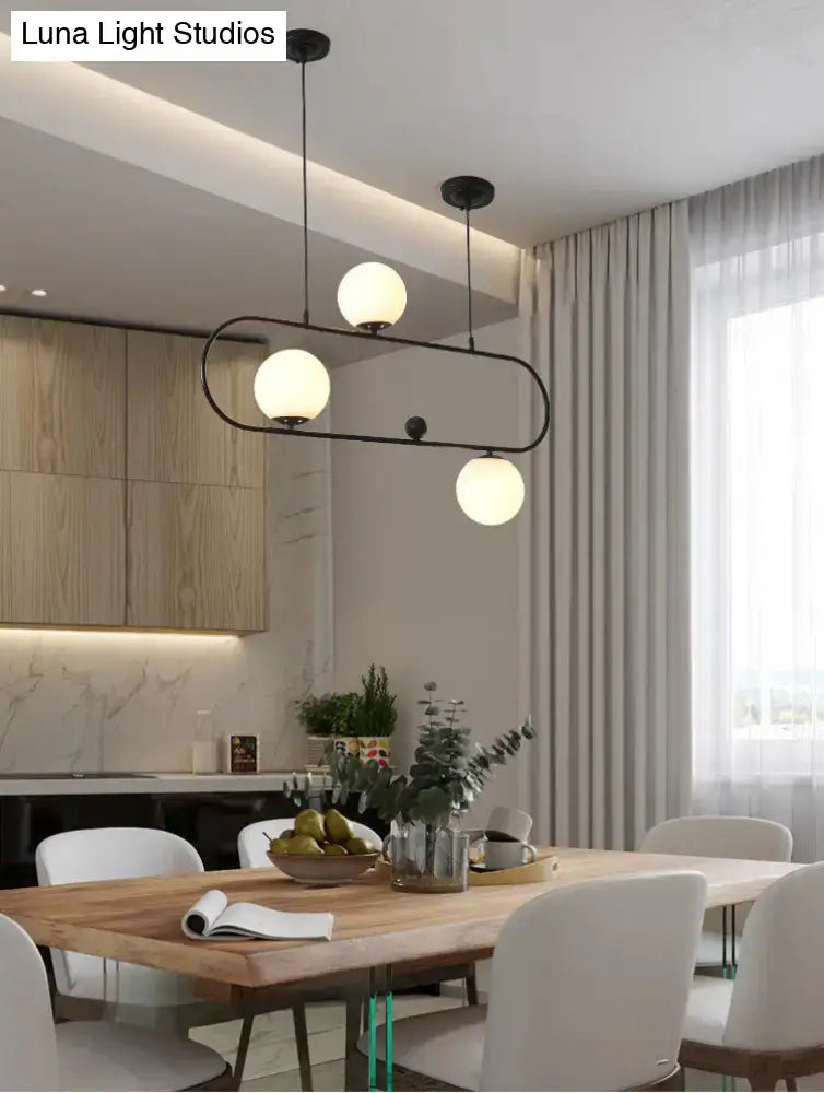 Modern black metal minimalist ellipse ceiling light with three frosted white globes for living room use