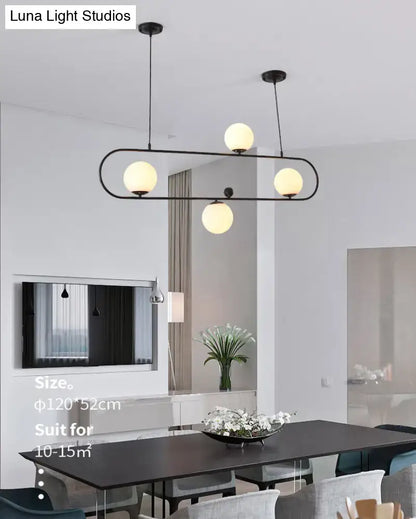 Modern black metal minimalist ellipse ceiling light with four warm white glass globes for living room illumination