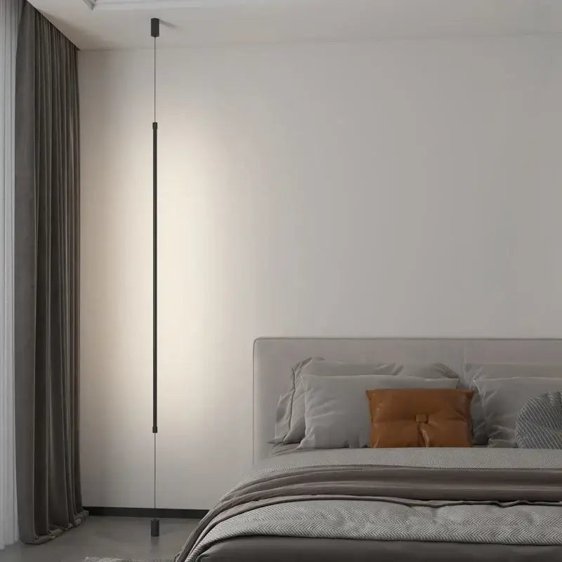 A sleek black led floor lamp with a minimalist cylindrical body and subtle lighting for modern living rooms