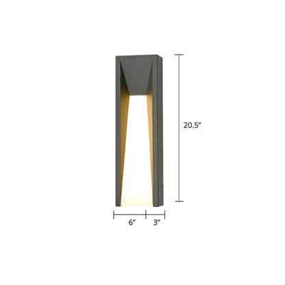 Modern black minimalist wall light with gray angular led sconce design emitting warm light for courtyard use