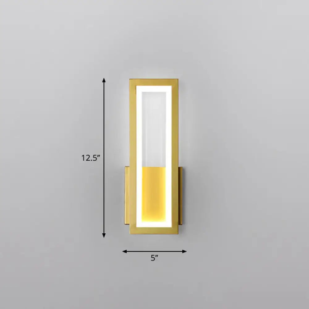 Modern black minimalist wall sconce with gold finish rectangular led panel emitting warm yellow foyer light