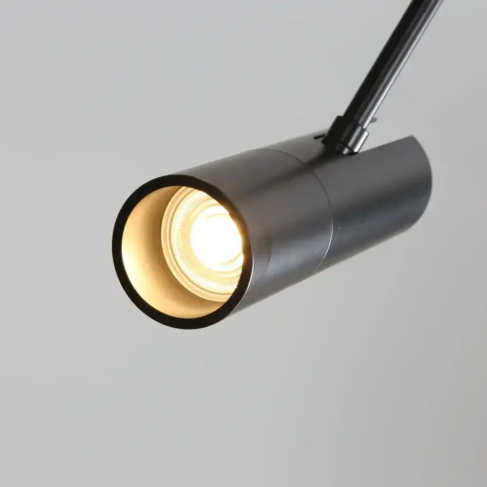 Modern black nordic pendant chandelier with adjustable black cylindrical track light and warm glowing bulb for dining room decorbites black nordic