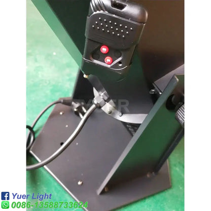Black plastic remote control with two red buttons and perforated top for modern 1500w rgb confetti cannon stage light