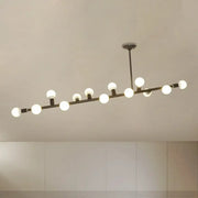 Modern black metal chandelier with open bulb design and evenly spaced white spherical bulbs in black finish