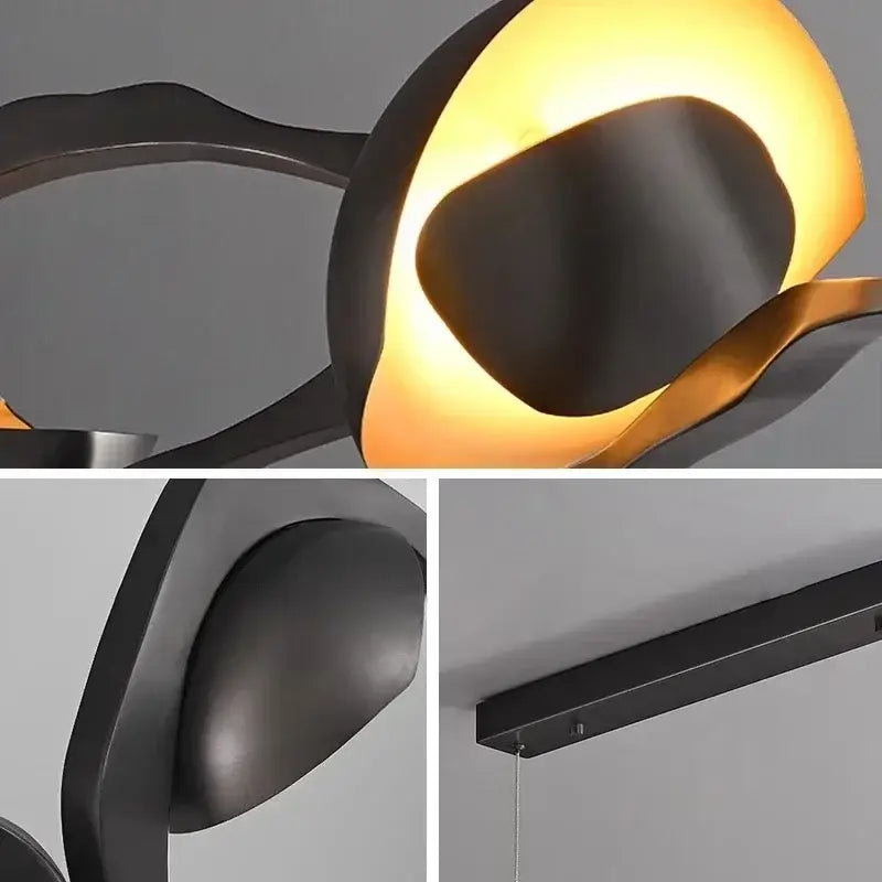 Modern black metal pendant light with a warm amber interior painted iron selected version for dining room use
