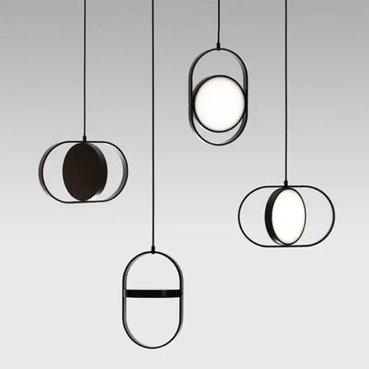 Modern black metal pendant light with adjustable angle sleek oval frames and glowing circular bulbs for dining room decorbites