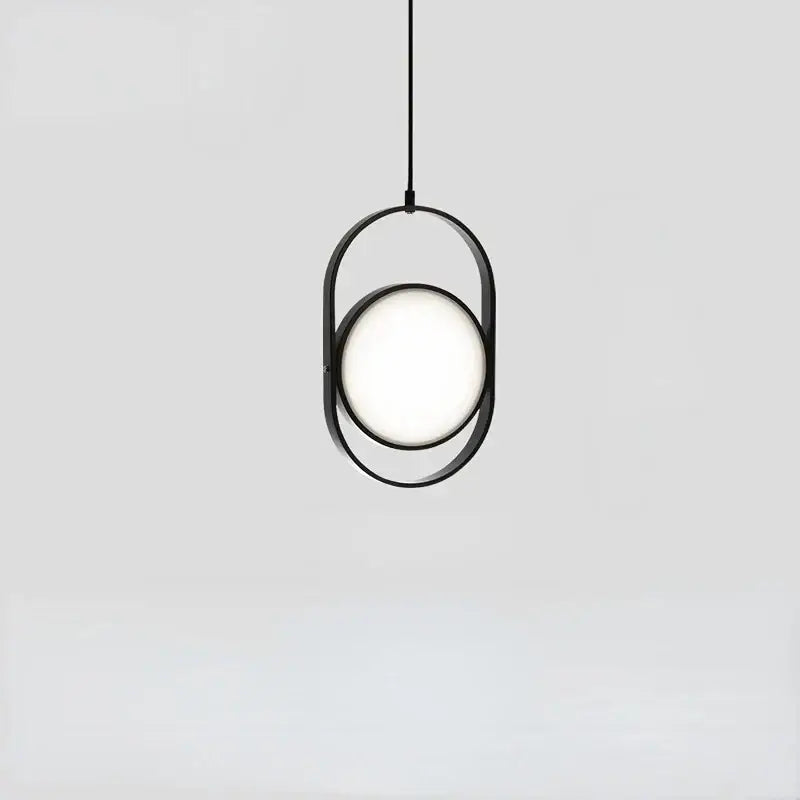 Minimalist black metal pendant light with glowing circular bulb and adjustable angle for dining room decorbites pendant light