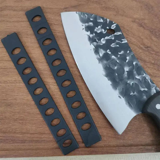 Modern black patterned knife blade protector set with oval holes beside hammered steel chef’s knife with dark handle