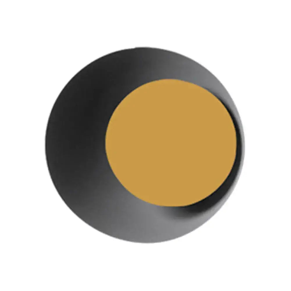 Modern black and pink circle sconce light fixture with a matte black ring and smooth gold center for bedroom wall use