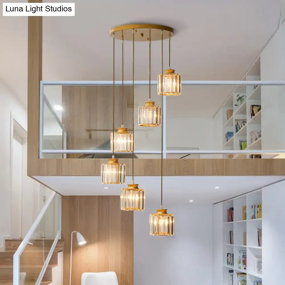 Gold-toned prismatic crystal cylindrical pendant lights with faceted glass shades by DecorBites™ for stairway lighting