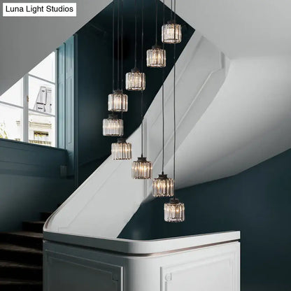 DecorBites™ modern prismatic crystal cylindrical pendant light with black gold finish and faceted glass shades for stairway