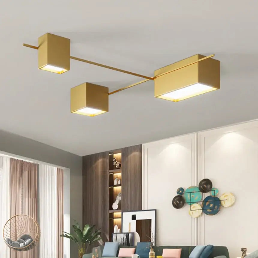 Modern black rectangular led ceiling lights featuring gold-finished cube lamps on a sleek horizontal bar for living rooms