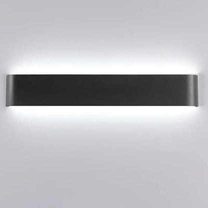 Modern black matte rectangular led wall lamp with sleek minimalist design providing warm glow for bedroom use