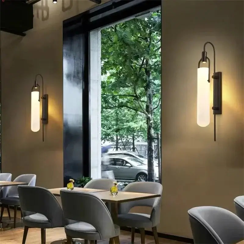 Modern brass-finished wall lamp with frosted glass cylinder diffuser for elegant glass shade led bedroom sconce lighting