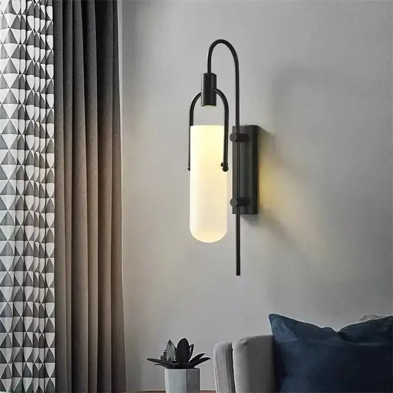 Modern black metal wall lamp with frosted glass cylinder diffuser and red glass shade led bedroom sconce