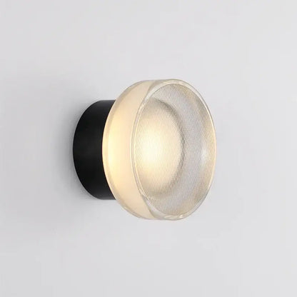 Modern black ribbed glass wall sconce with a cylindrical base and frosted dome for elegant glass led decorbites lighting