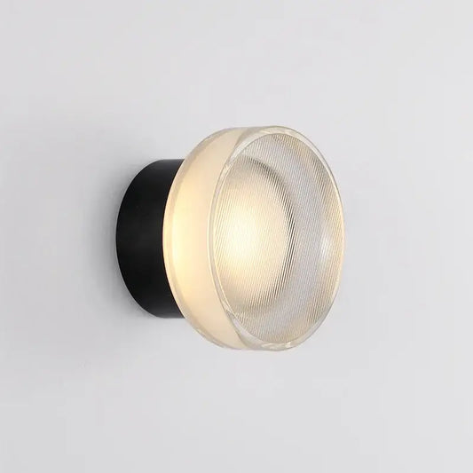 Modern black ribbed glass wall sconce with a cylindrical base and frosted dome for elegant glass led decorbites lighting