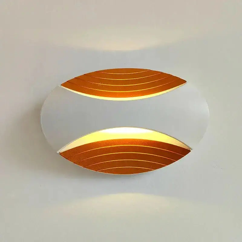 Modern black ribbed led wall lamp with sleek white body and warm amber gold illuminated panels for corridor lighting