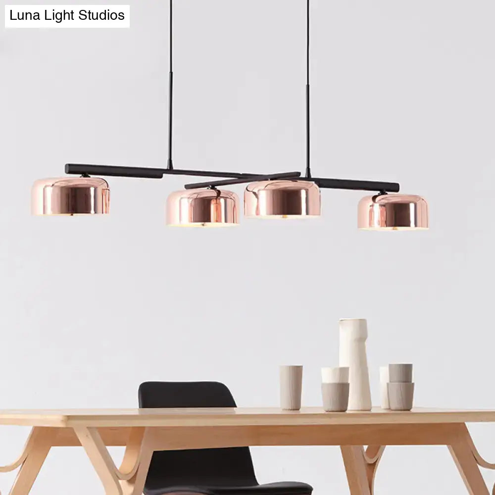 Modern black rose gold diner island lamp with copper-finished pendant lights and four dome-shaped shades