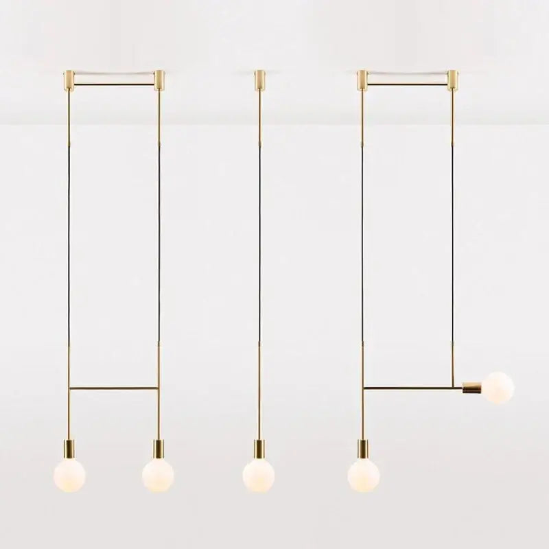 Modern black rose gold minimalist pendant light with brass fixtures and frosted glass bulbs for dining room decorbites black rose