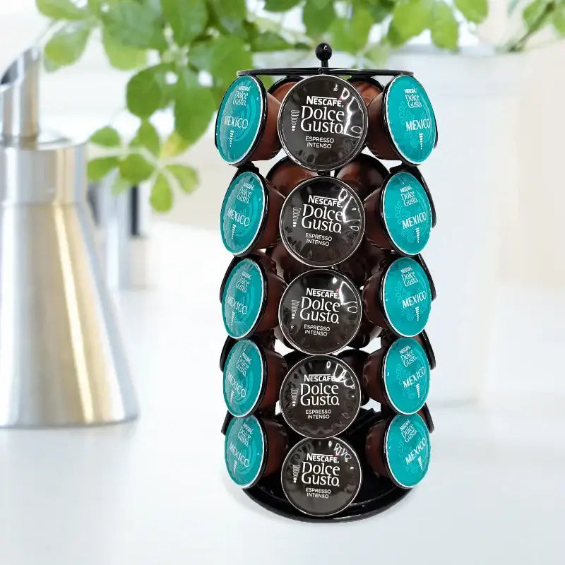 Modern black metal rotatable dolce gusto capsule rack displaying teal and dark brown nescafe dolce gusto capsule lids by decorbites