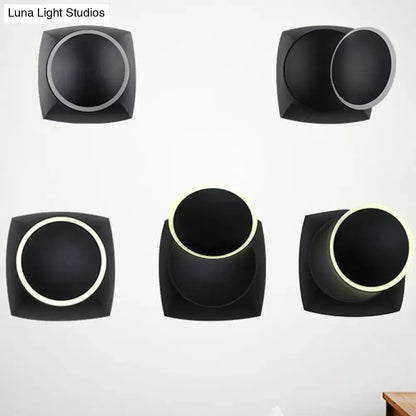 Modern black rotatable led wall sconce with square frame and circular illuminated interior for bedroom lighting