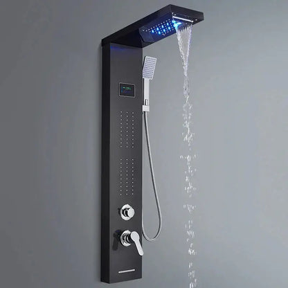 Modern black shower panel rainfall waterfall system with large rainhead emitting blue led light and handheld showerhead