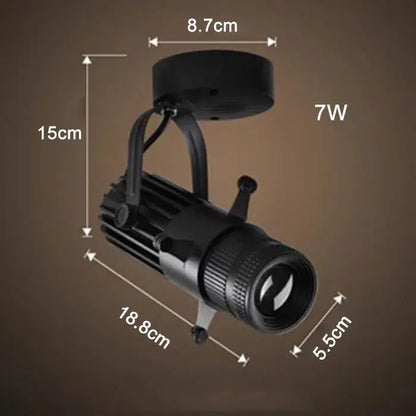 Modern black and silver decorbites adjustable led track spotlight with cylindrical body and textured lens housing