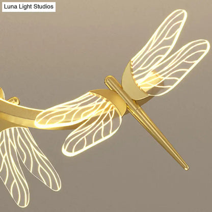 Golden dragonfly-shaped led ceiling light with glowing edges and intricate wings by decorbites for restaurant ceilings