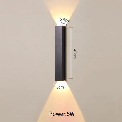 Modern black and silver led wall lamp with sleek rectangular design and warm up and down light sources for bedroom