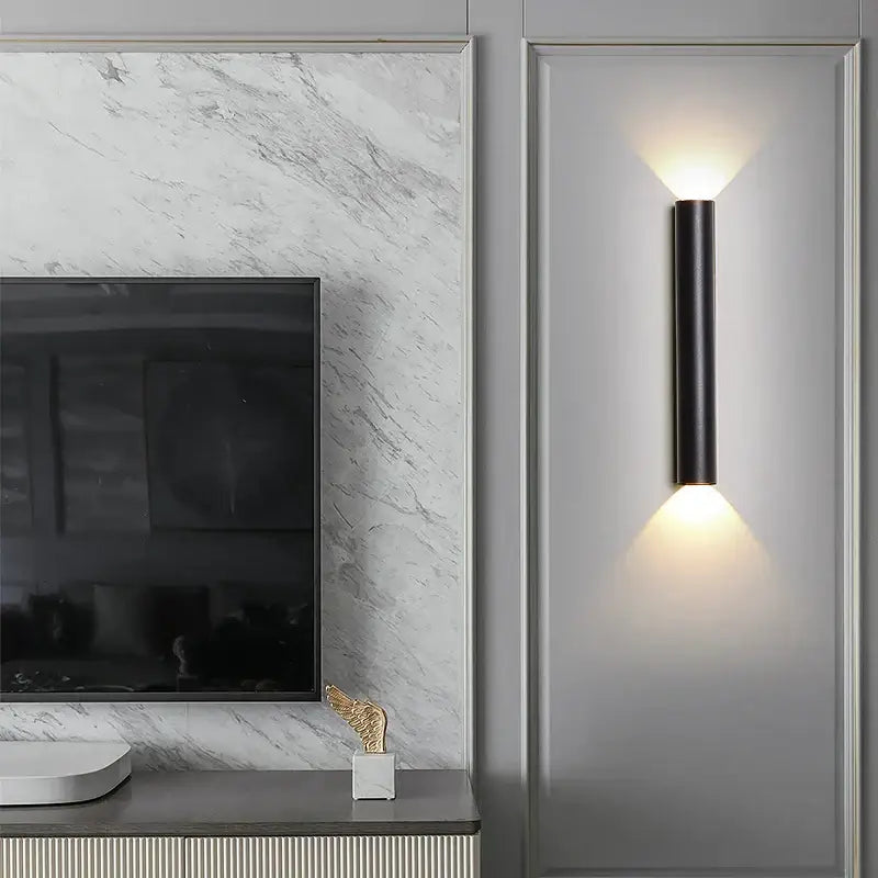 Modern black and silver led wall lamp with warm focused lighting ideal as a bedroom or tv background wall lamp