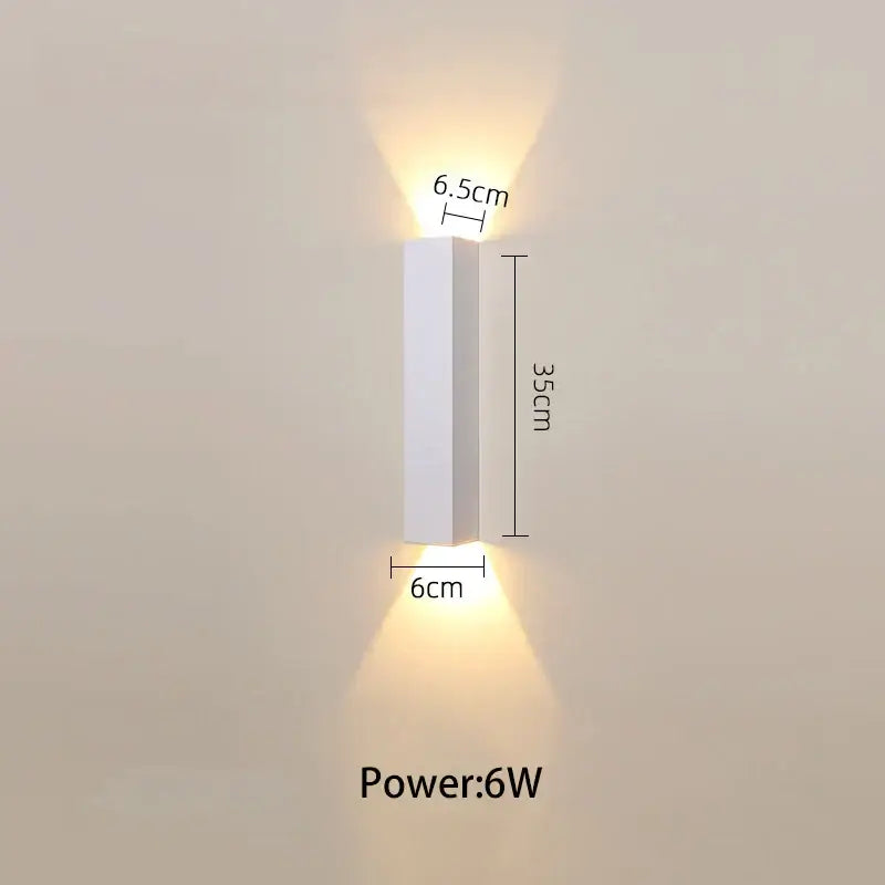 Modern black and silver led wall lamp with white rectangular lone line sconce and warm downward-facing lights for bedroom