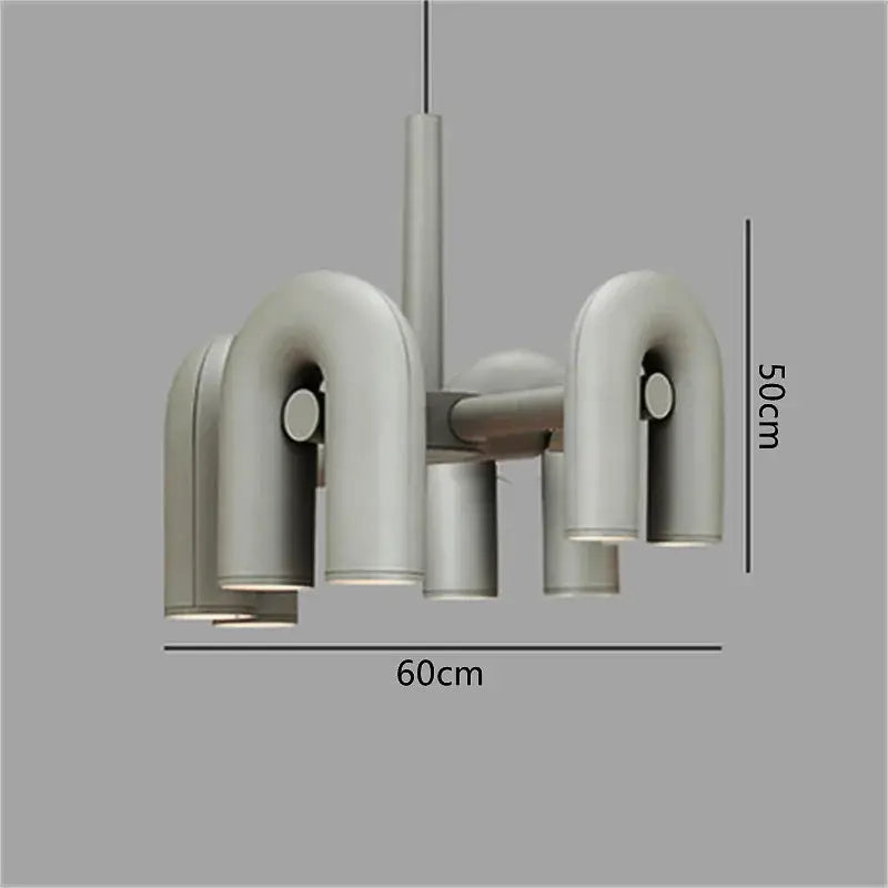 Modern black and silver minimalist tube wall lamp with sleek curved metallic arms and cylindrical shades for bedroom use