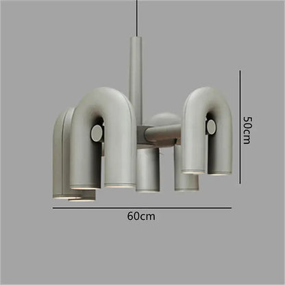 Modern black and silver minimalist tube wall lamp with sleek curved metallic arms and cylindrical shades for bedroom use