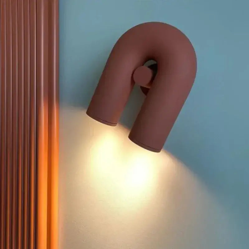 Terracotta u-shaped wall lamp with matte finish and minimalist design for modern bedroom tube wall lamp use